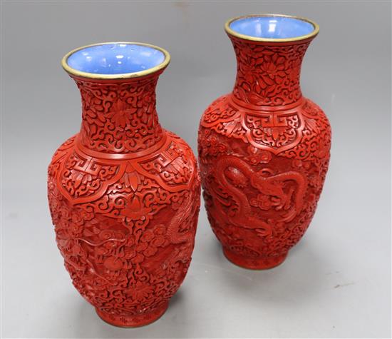 A pair of Chinese cinnabar lacquer vases, height 23cm